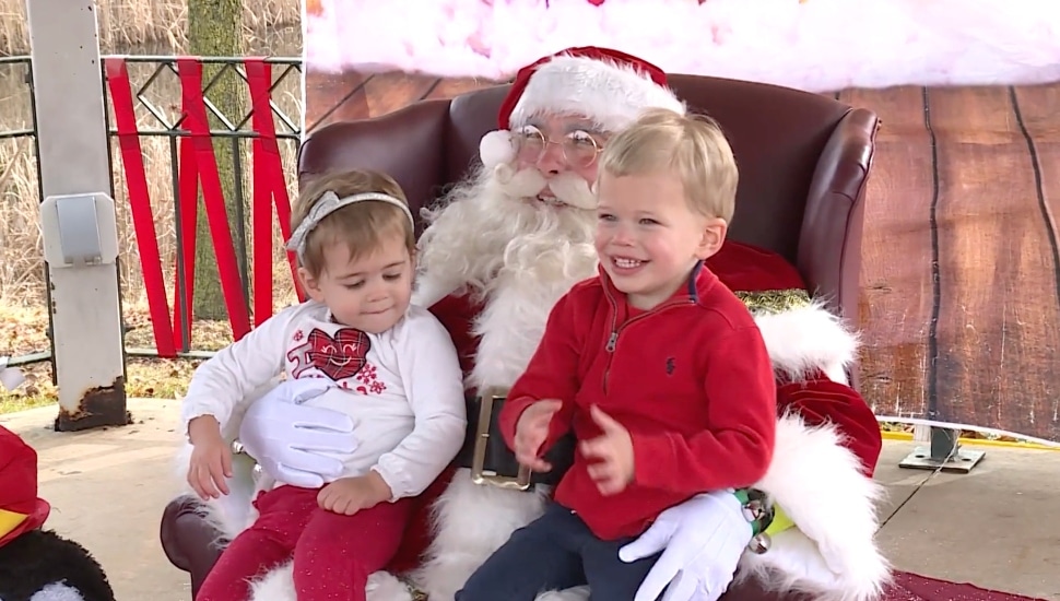 Children sit with Santa at the Upper Merion Holiday Village.