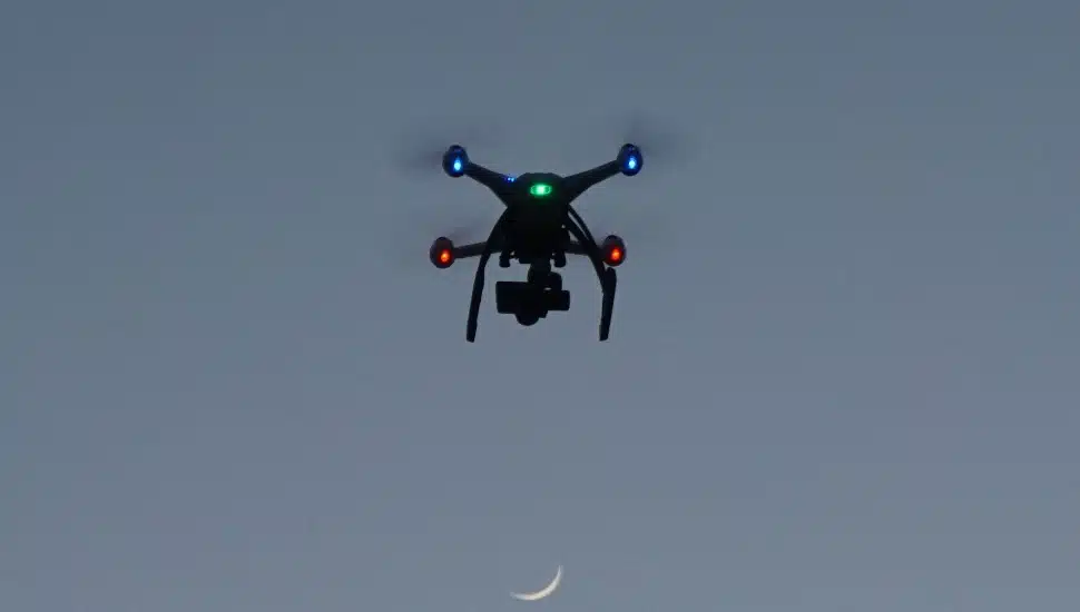A drone flying in the night sky.