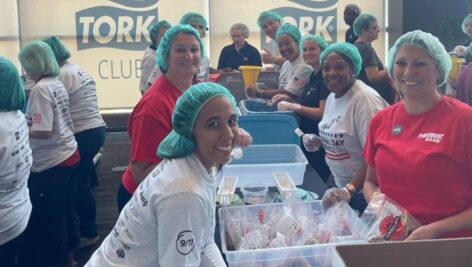 volunteers pack meals