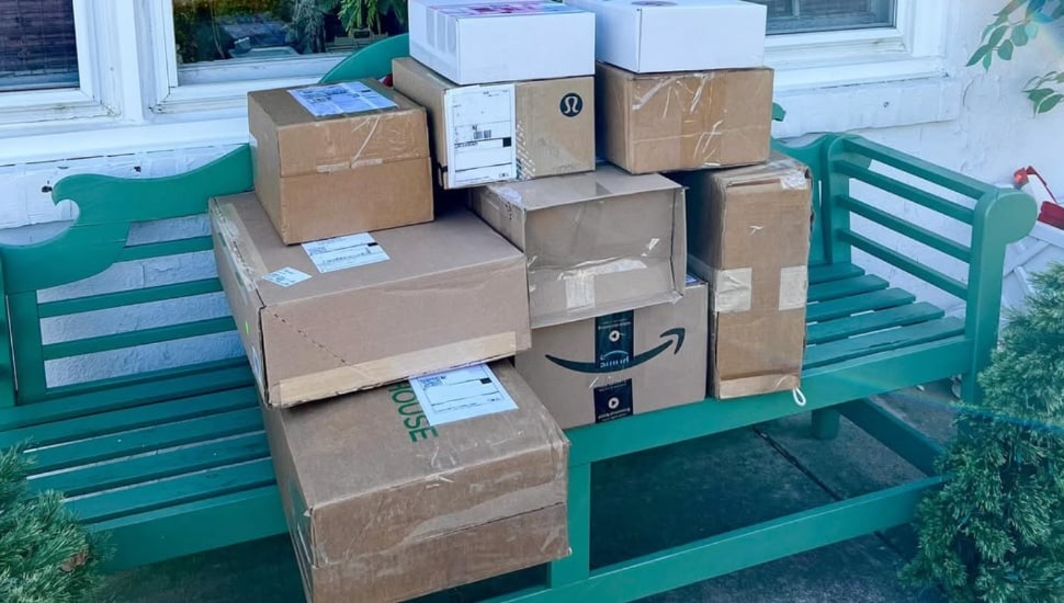 A pile of boxes on a bench ready to be returned.
