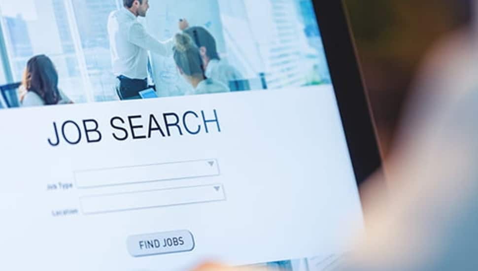 Person searching for a job at a laptop computer.