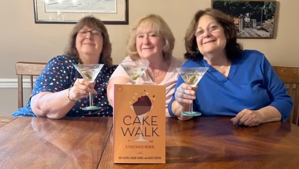 Carole Algier, Sue Katein, and Kathy Lanyon of Full Spirited Flavours smiling with cocktails and their book.