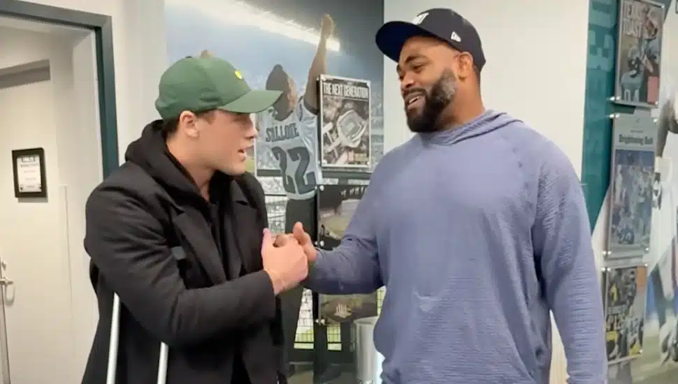 Ryan Quigley shakes hands with Brandon Graham.