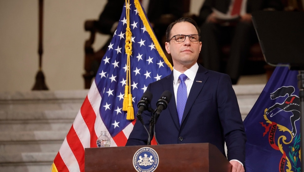 Governor Shapiro standing at a podium.