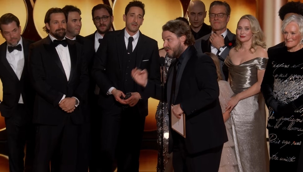 The Brutalist case on stage at Golden Globes after winning.