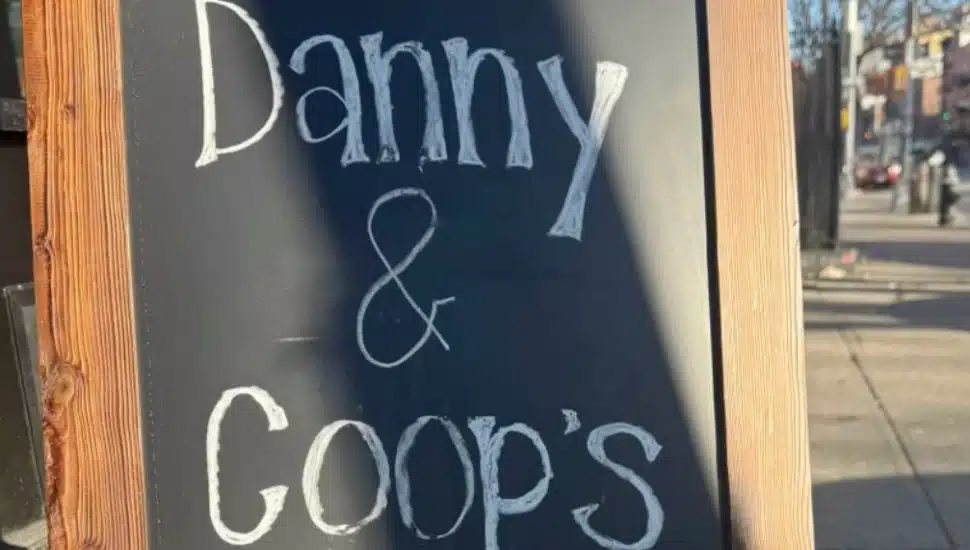 A Danny and Coop's sidewalk sign.