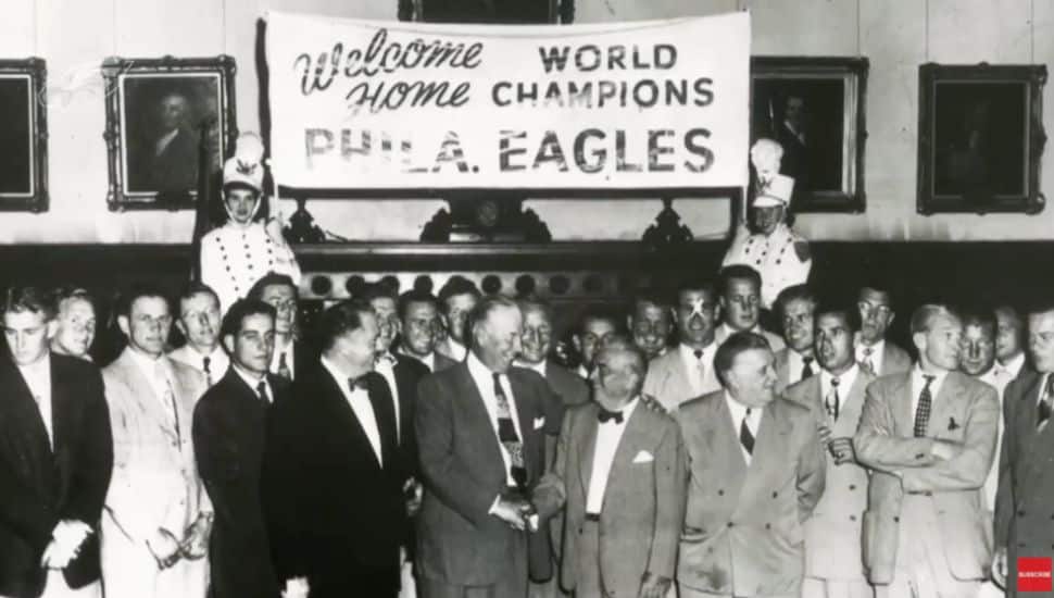 1960 Eagles team gathering for photo after win.