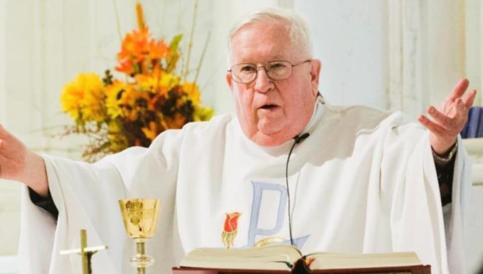 Father Kilgallon stands at the pulpit.