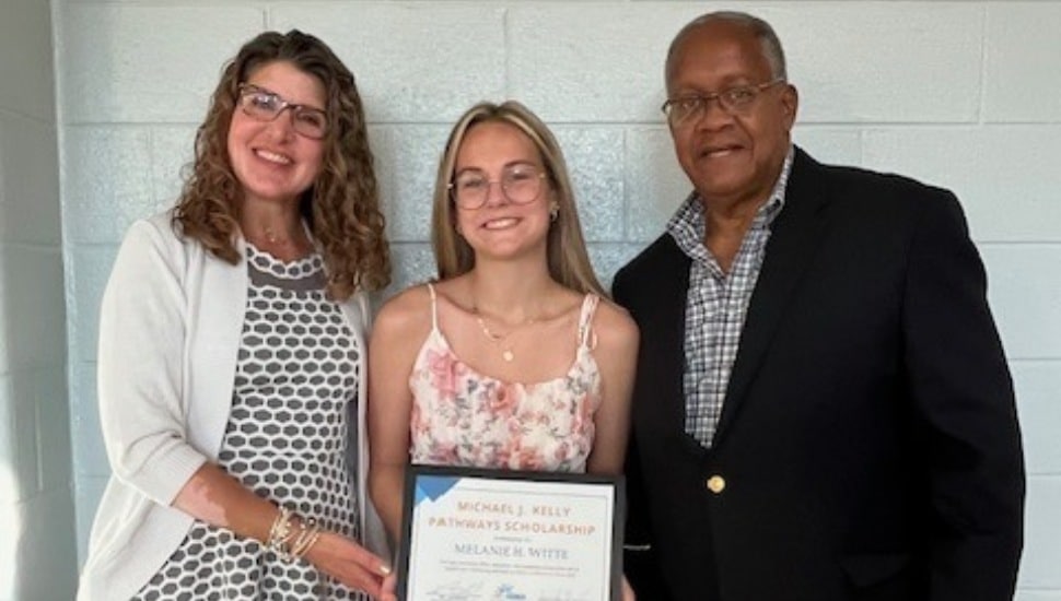 Melanie Witte (center) stands with Jennifer Hernandez (left), and Leon Spencer.