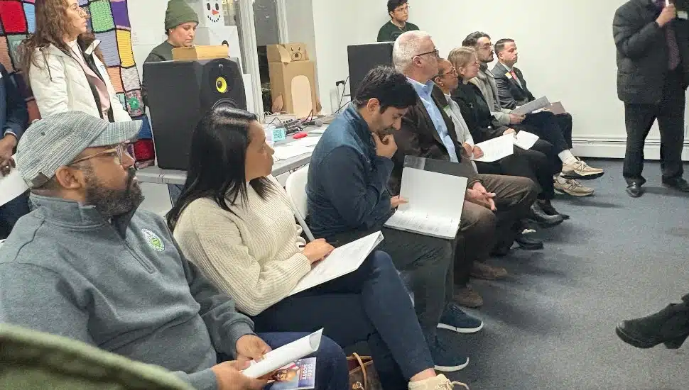 Jamila Winder and Neil Makhija sit at the Norristown forum.