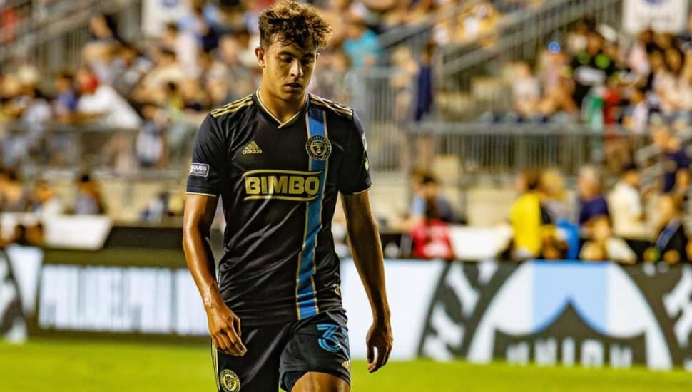 Quinn Sullivan walks across the pitch.
