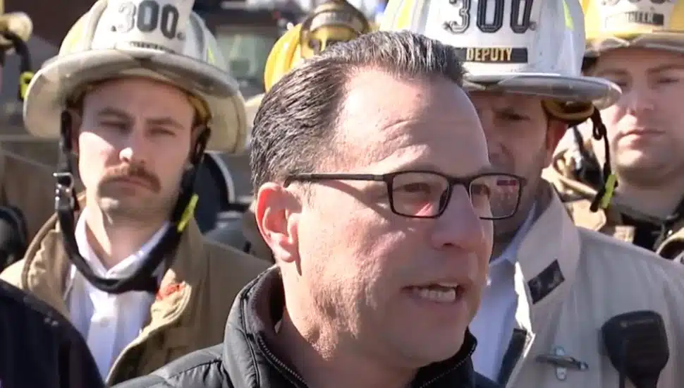 Josh Shapiro speaks with firefighters.