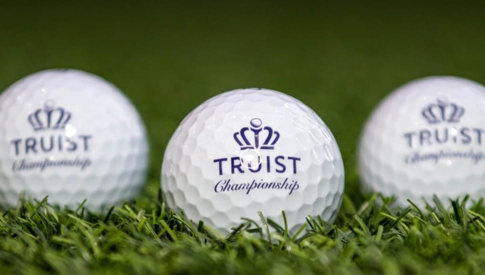 Three golf balls with Truist Championship inscribed.
