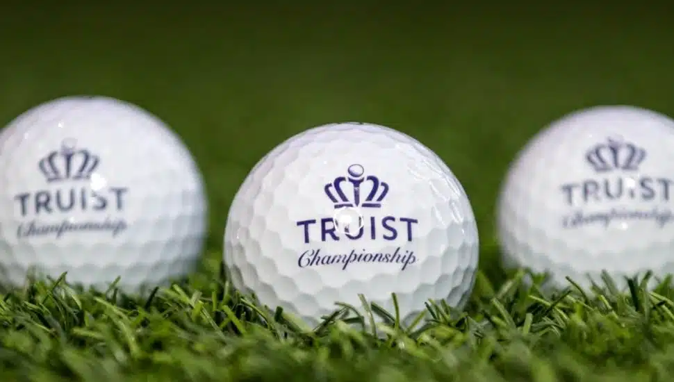 Three golf balls with Truist Championship inscribed.