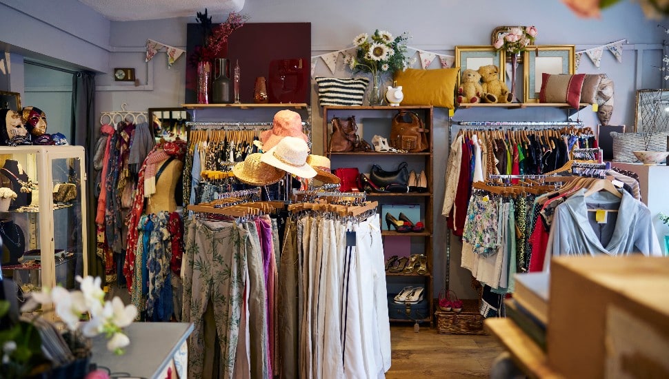The inside of a thrift shop with secondhand clothes.