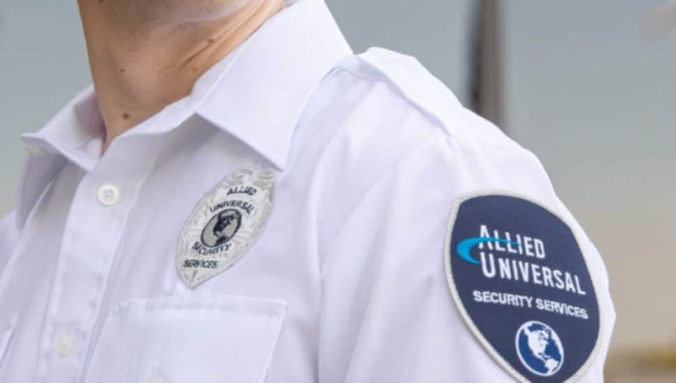 A security guard wearing Allied Universal uniform.
