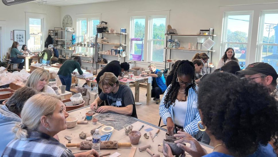 People working at Centered Clay Studio.
