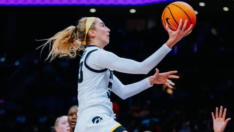 Lucy Olsen in the air for a layup.