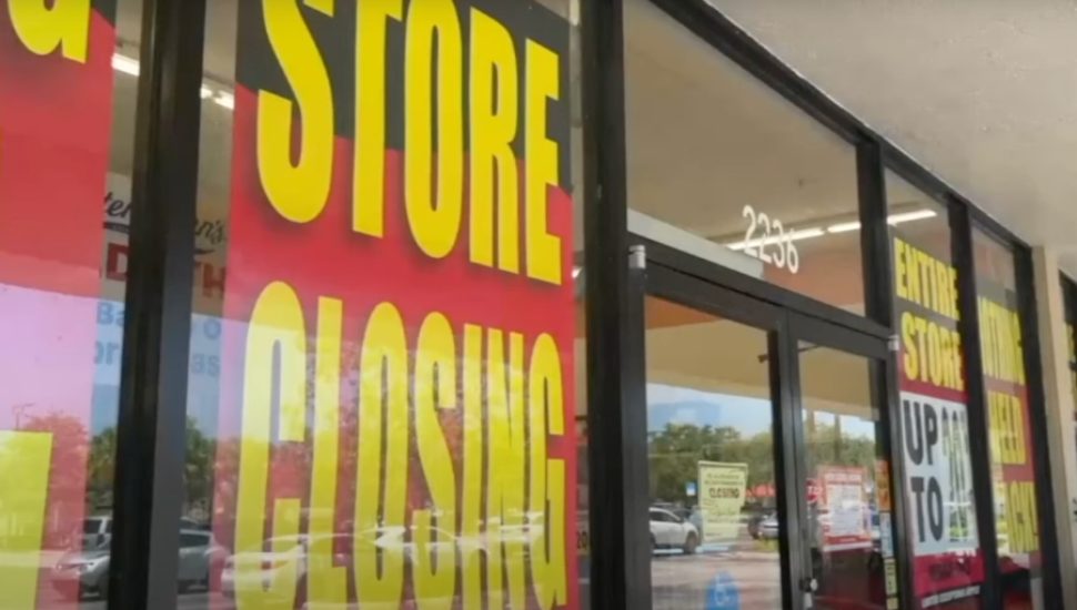 Store Closing signs in the window of Party City.