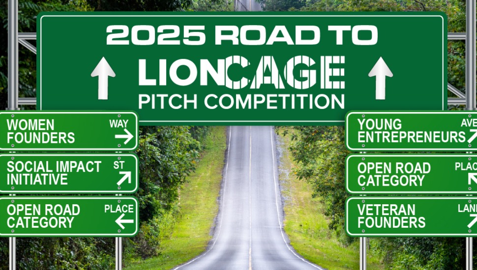 "2025 Road to LionCage Pitch Competition" sign on a highway with directional road signs for different competition categories, including Women Founders, Social Impact Initiative, Open Road Category, Young Entrepreneurs, and Veteran Founders. Green road signs with white text set against a scenic tree-lined road background.