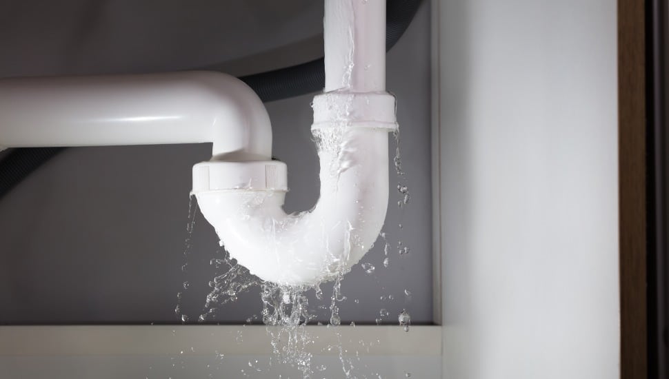 Close-up view of a leaky pipe.