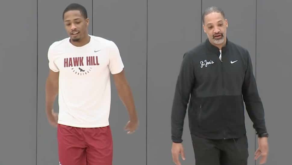 Justin Scott and Xzayvier Brown practicing basketball.