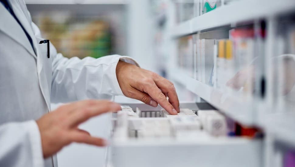 Pharmacist going through medication.