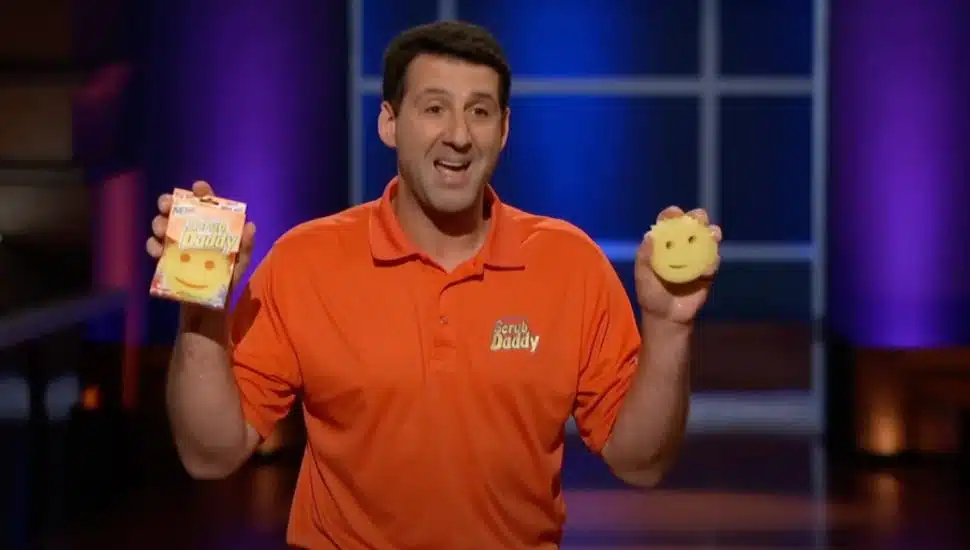 Aaron Kruase holds up his product, the Scrub Daddy, during his Shark Tank pitch.