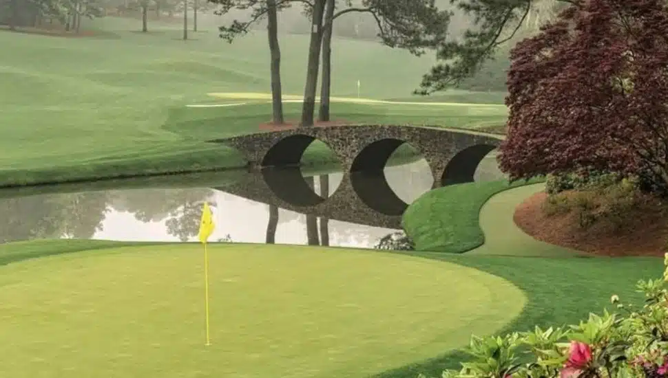 Overlooking a green and a bridge over water at Augusta National.