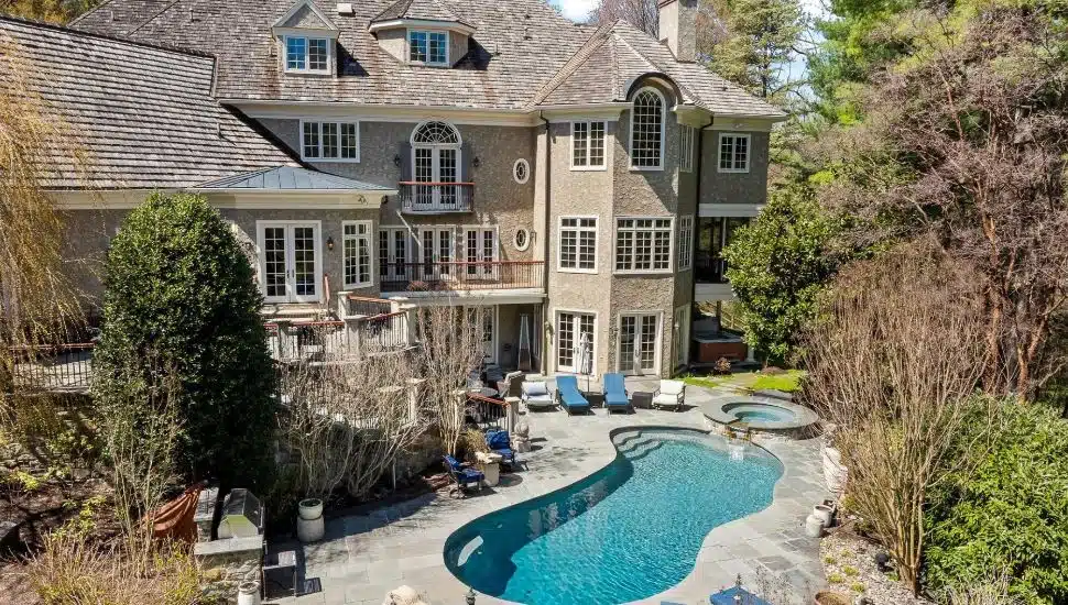 Waverly Road Gladwyne Mansion's rear view with pool.