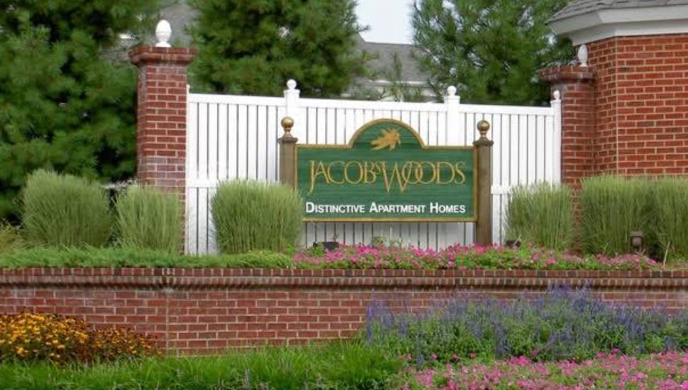 The Jacobs Woods Apartments sign outside complex.
