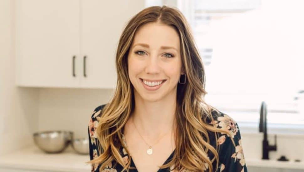 Jen Benner stands in her kitchen.
