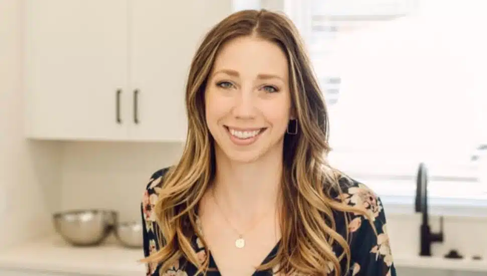 Jen Benner stands in her kitchen.
