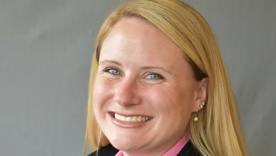 Headshot of female CFO with blond hair.