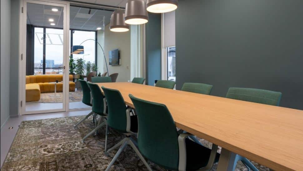 A long table in an Office Evolution Conference Room.