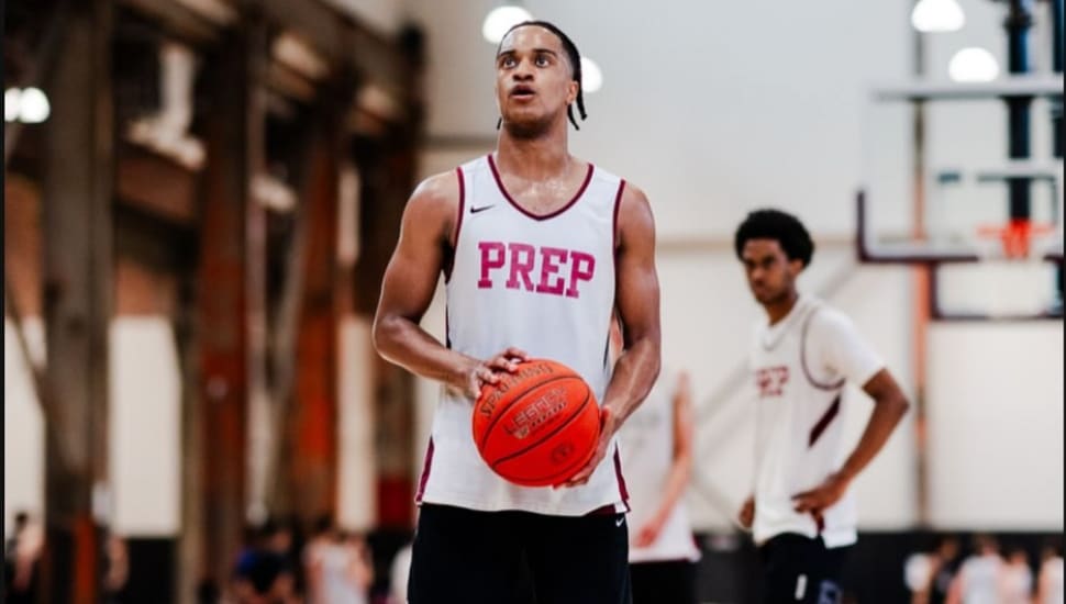 Olin Chamberlain Jr. eyeing the basket as he prepares to shoot a free throw.