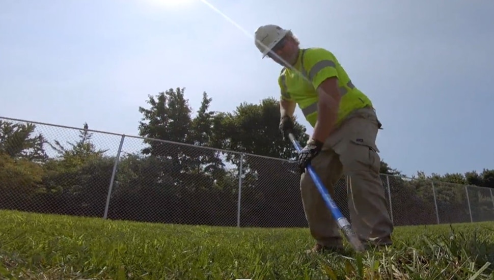 A utility worker practices safe digging.