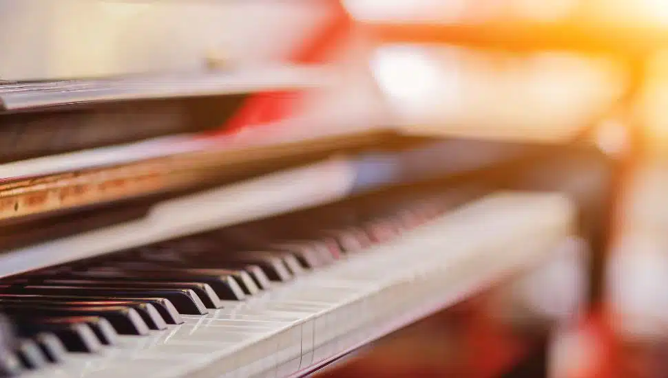 Beautiful piano background are set by the window in the morning waiting for the pianist to come to practice in the morning to reduce the mistake of having to perform the piano performance at a concert