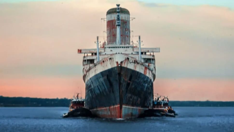 Frontal view of the SS United States on the water.