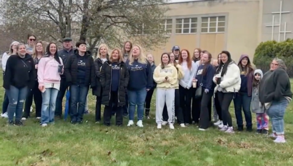 A group of St. Basil Alumni gathered to host a vigil outside of their alma mater.