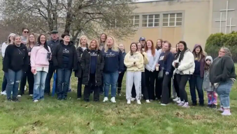 A group of St. Basil Alumni gathered to host a vigil outside of their alma mater.