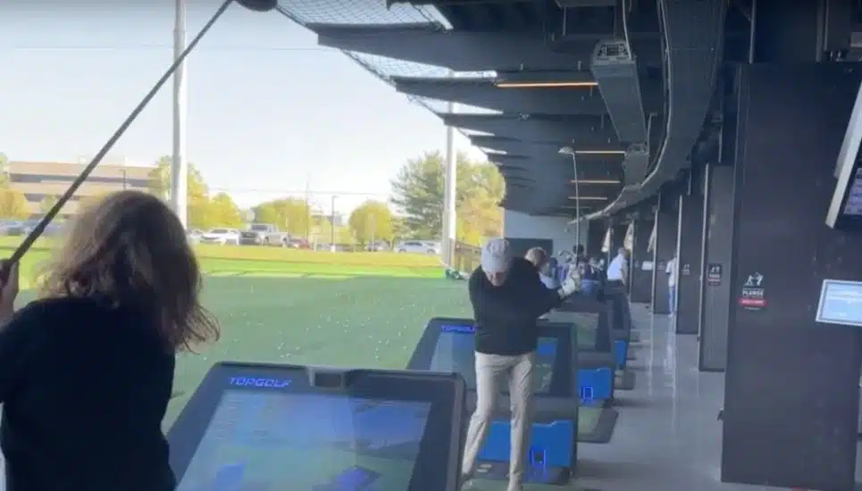 Volunteers tee off at the King of Prussia Topgolf.