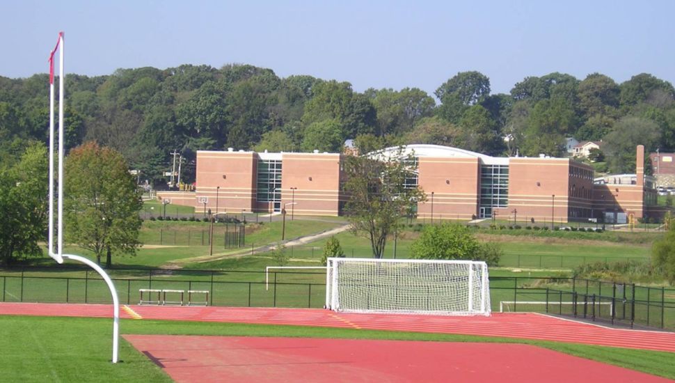 The Abington Senior High School in the background of a football field.