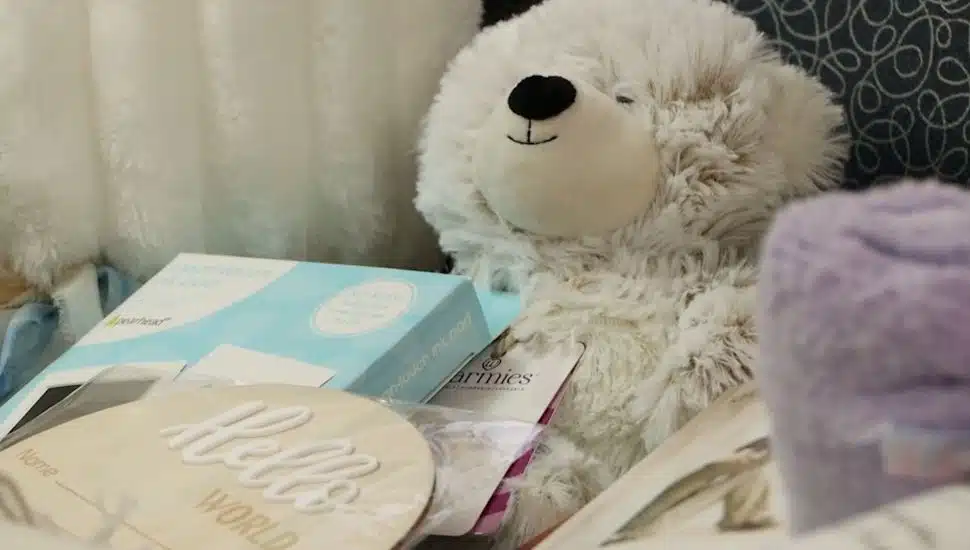 A bereavement basket with a teddy bear.