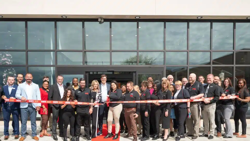 Staff gather to cut the ribbon at the Bob's Discount Furniture store in Montgomeryville.