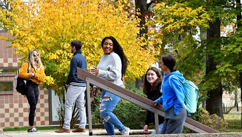 College students walk up the steps on campus.