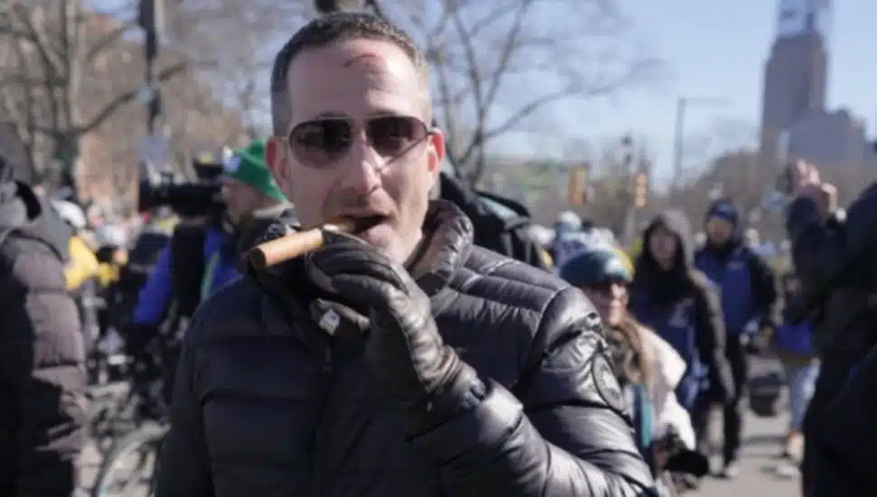 Howie Roseman smoking a cigar with a fresh scar on his forehead at the Super Bowl parade.