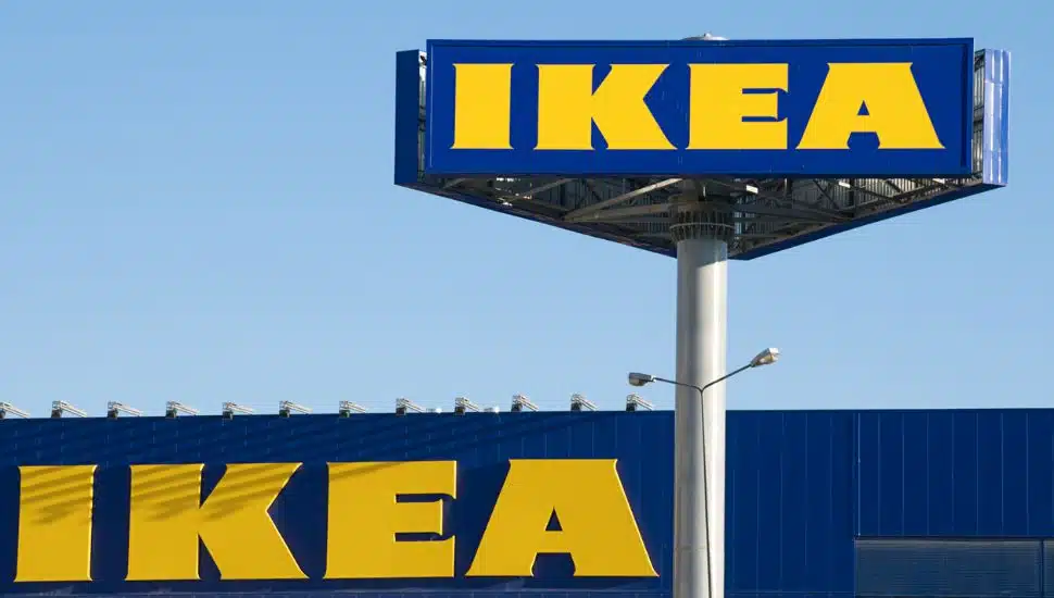 A large IKEA highway sign over an IKEA store.