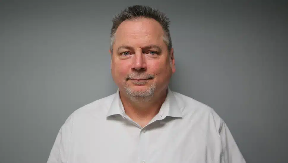 Headshot of union leader wearing white collared shirt.