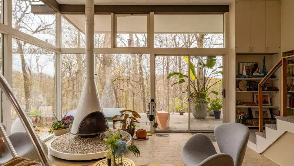 Living room with freestanding fireplace in a Richard Neutra-designed home.
